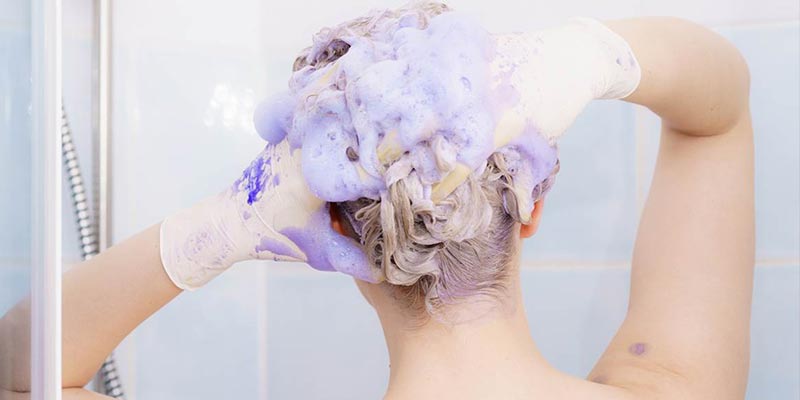 washing hair with purple shampoo banner